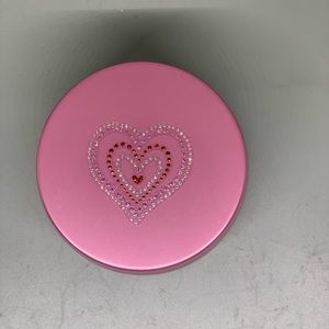 Beautiful large pink tin candle.